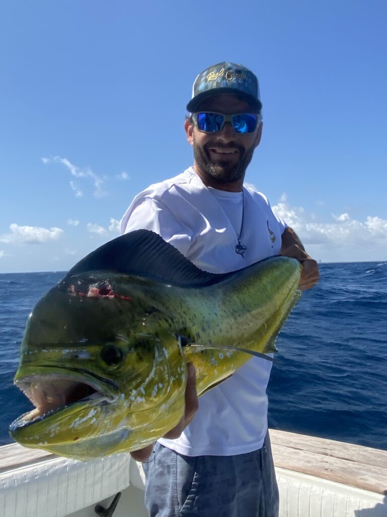 Angler holding a fish during Florida sportfishing trip